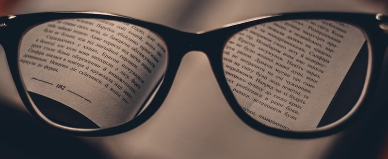 Glasses looking at a book