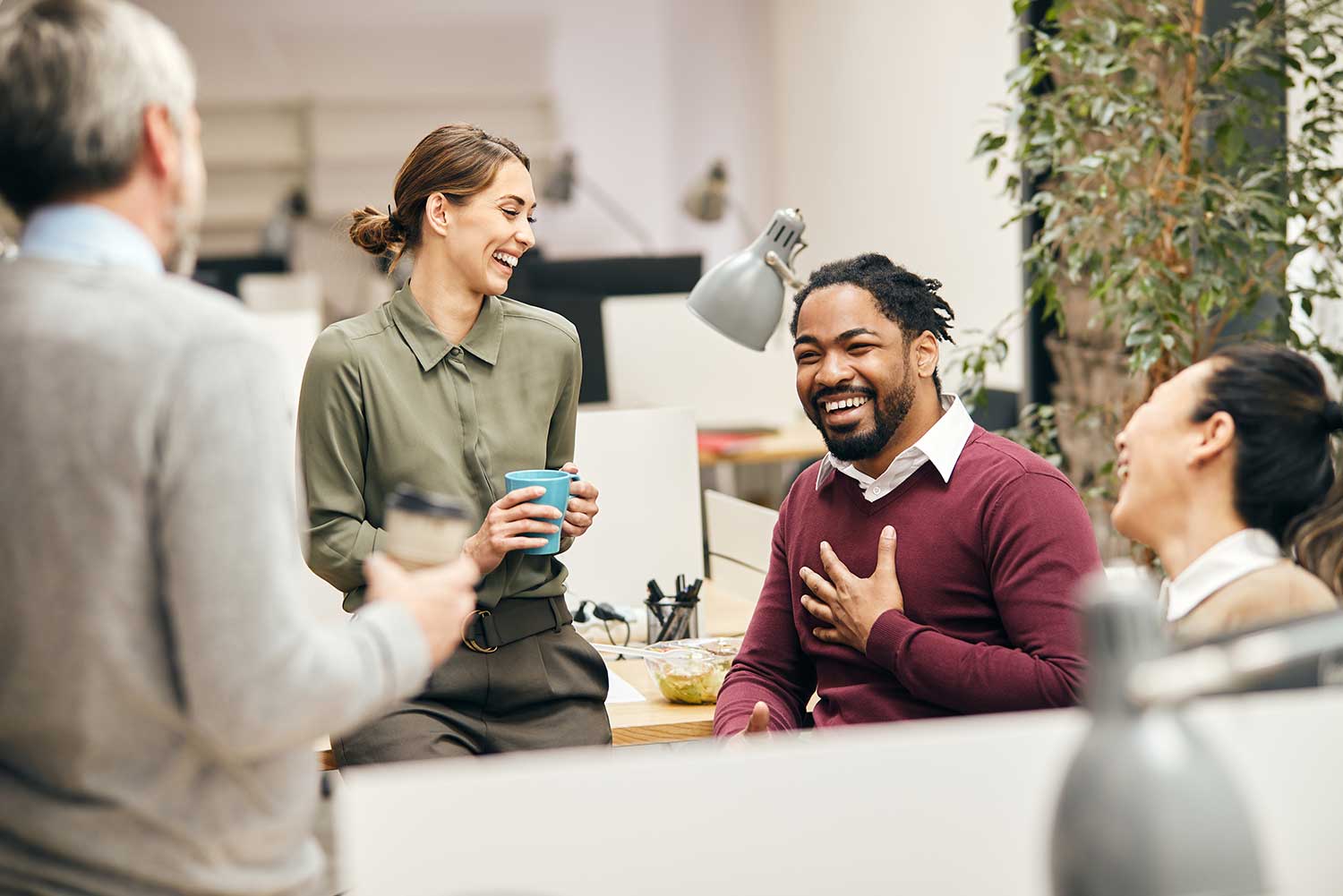 A group of colleagues laughing together