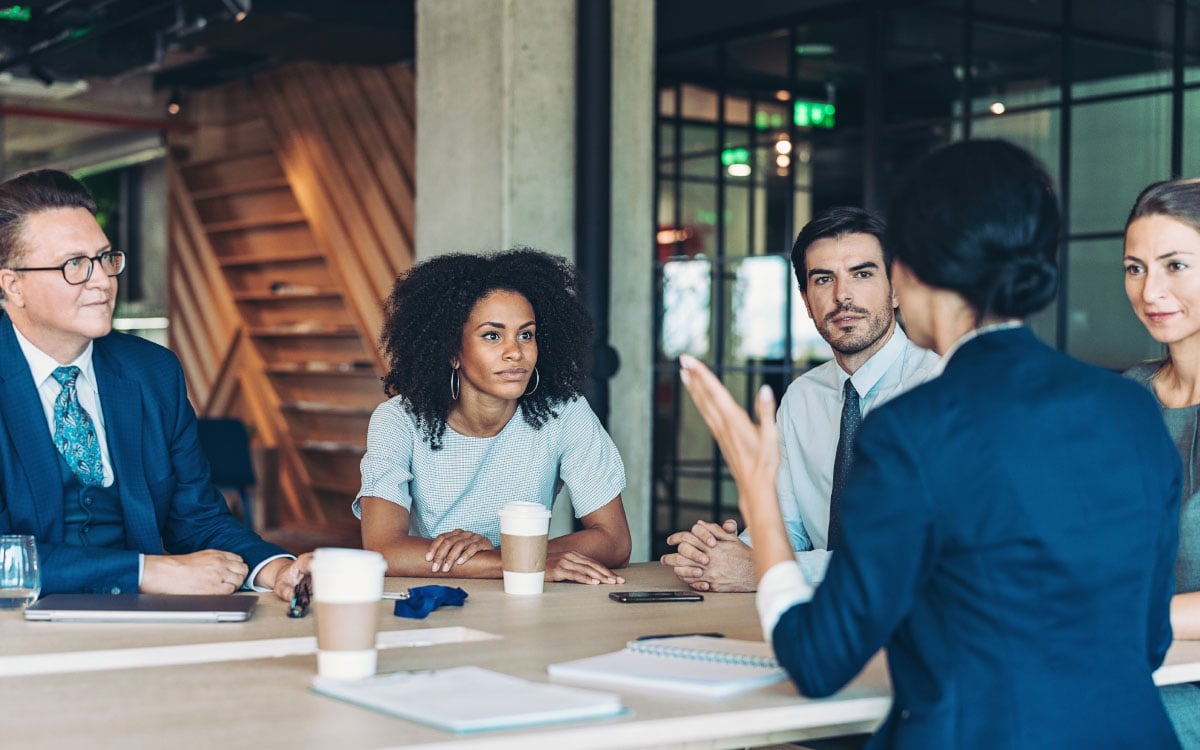 Group of business people around a table