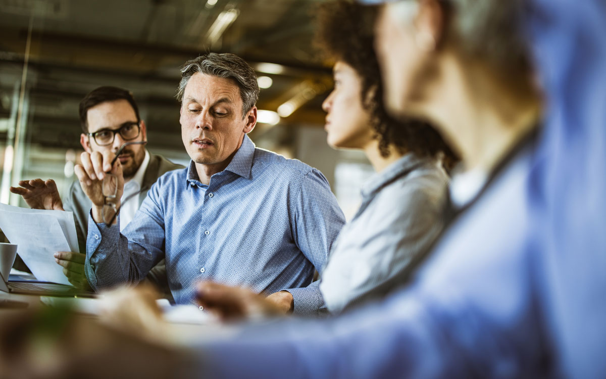 A group of business people discussing at a table