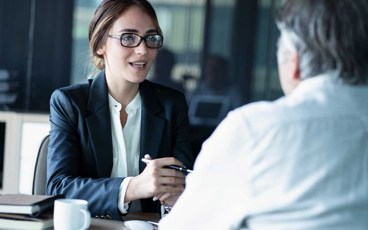 Business woman and man in a meeting together 