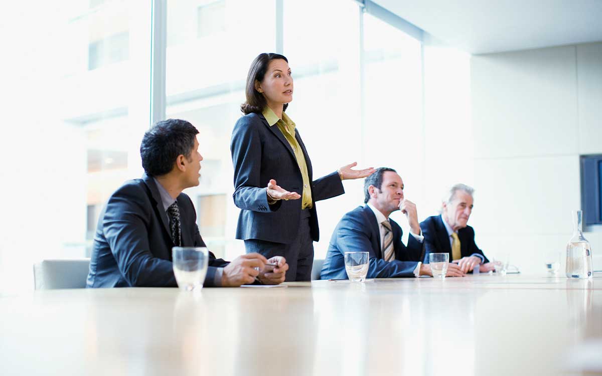 Woman talking in a business meeting at a table