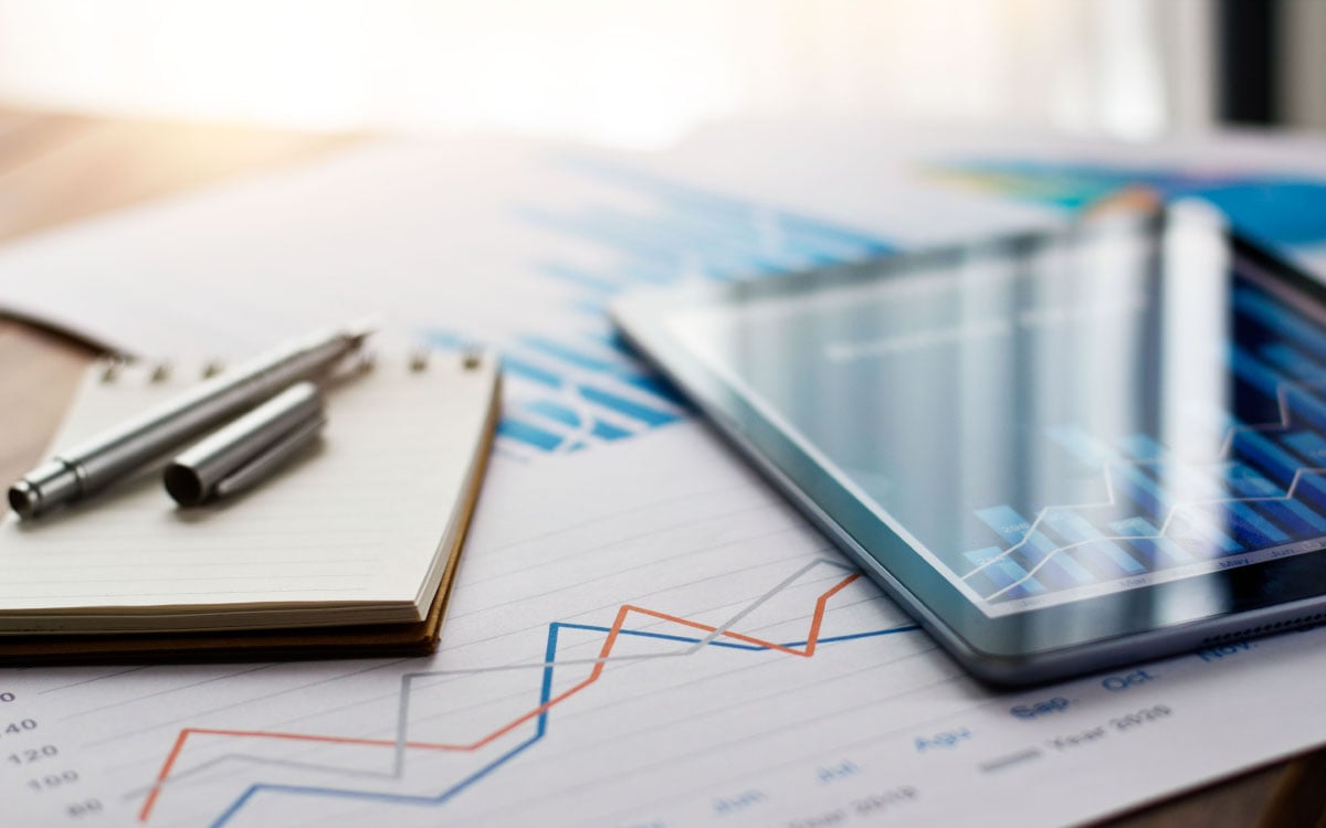 Tablet on a table with graphs