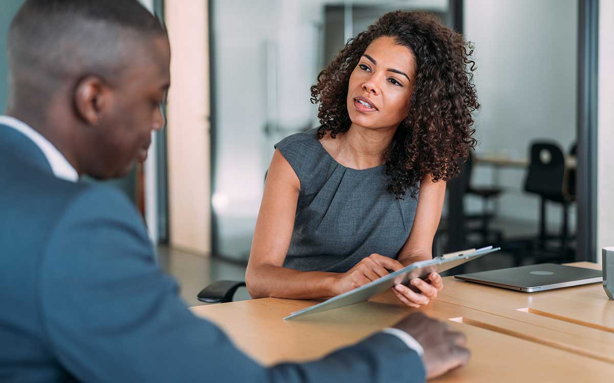 Business woman talking to a man in a meeting